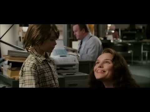 Trailer still — Superman above Metropolis, sun flaring off the cape