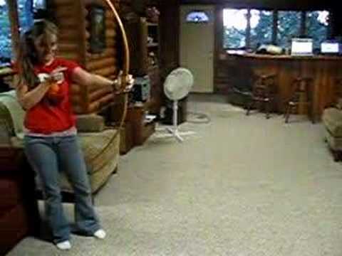 Bridget shooting around with the antique archery set!