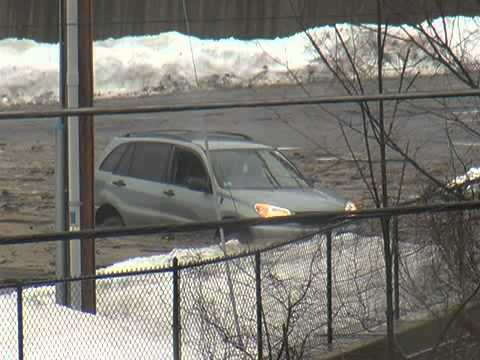 Mudslide traps SUV in Greenfield