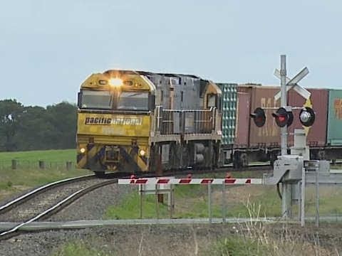 Freight Train at Level Crossing in Victoria - PoathTV Railroads and Trains in Australia