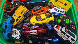 Box Full of Toy Cars of Different Sizes
