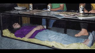 MAN KEEPS DEAD WIFE IN GLASS COFFEE TABLE