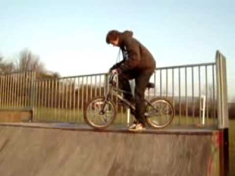 barspin over spine BMX