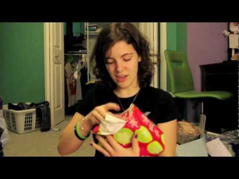 Shelby opens her secret santa gift