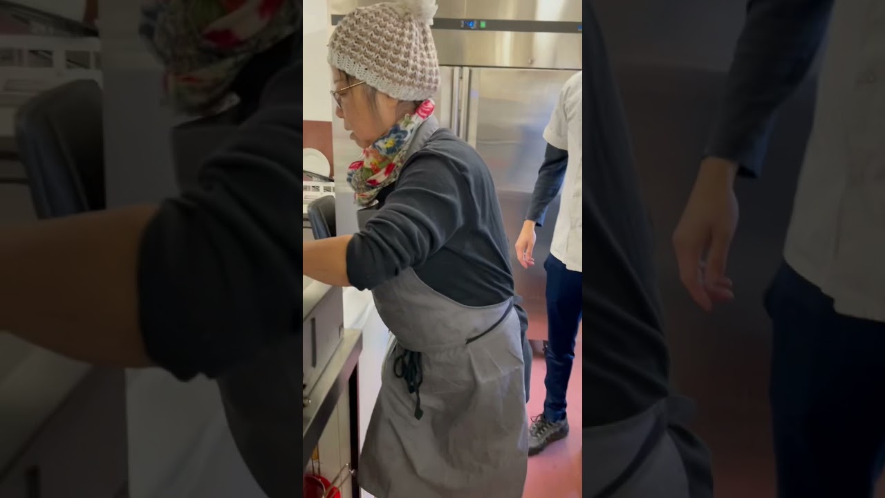 Mum teaching Xiā Bing to the team