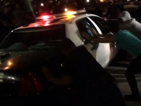 Arab Today- Protesters Attack Cop Car After Trump Rally