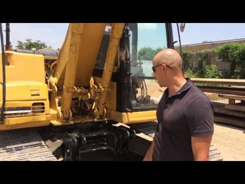 YouTube video about: How much does a 312 cat excavator weight?