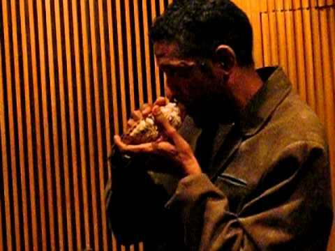 William Cepeda playing conch shell