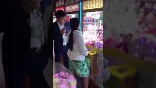 Lady cheating in the claw machine