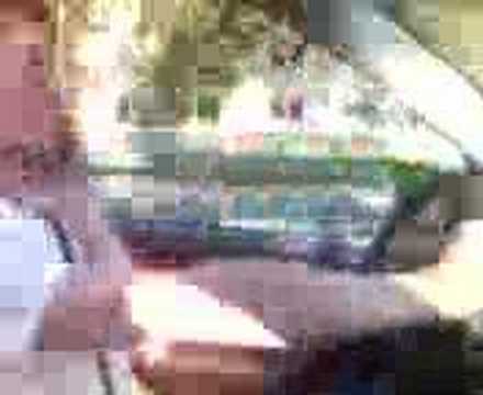 Girl driving big BMW (X5) through Munich