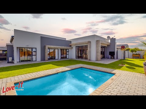 Natural light flows into the living areas of this Modern Single Level Home.