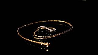 CI0001374 - 1.1 grams 9 carat Yellow Gold Chain and Zirconia Pendant