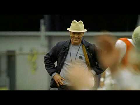 Radio (2003) trailer still with Coach Jones and Radio on the sideline — visual cue for the film’s soul-and-score palette