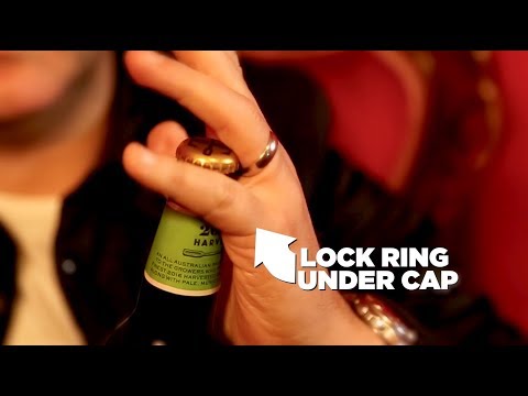 Part of a video titled How to open a beer with your wedding ring - YouTube