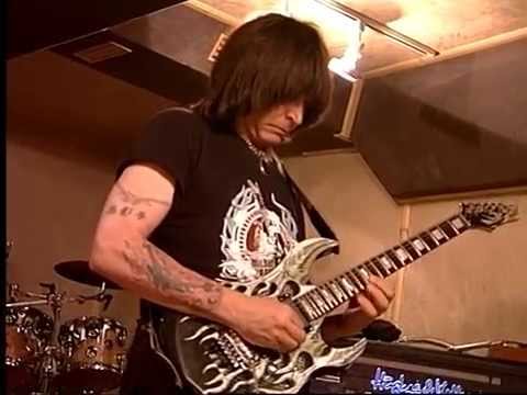 Michael Batio and Neil Zaza perform thier music live in a studio located in Thailand