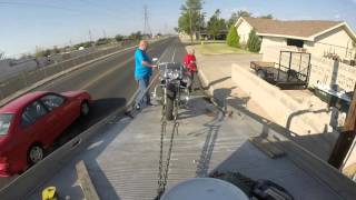 Loading a motorcycle onto a flatbed