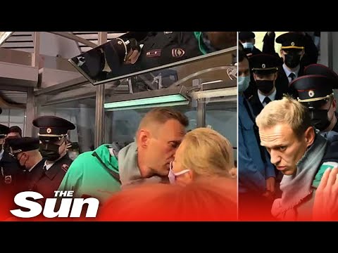 Poisoned Putin critic Navalny 'not afraid' as he's detained