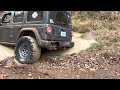 Jeep Rubicon on 37s buried in mud puddle, hydrolocked