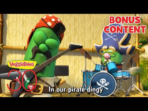 VeggieTales characters perform pirates-themed music on stage; band with cucumber playing guitar and another at drums, 'BONUS CONTENT' text overlays.