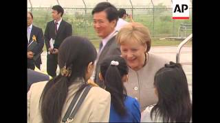 WRAP Brown, Merkel arrive at G8 summit ADDS Ban