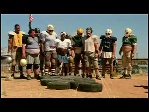 Trailer frame of The Longest Yard (2005): Sandler’s Crewe in chaos, teeing up a hip-hop/rock needle-drop palette