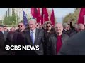 Albanian opposition leader Sali Berisha punched in the face during anti-government protest