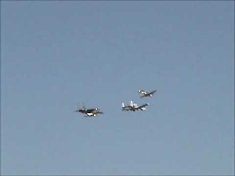 A10, F15 and 2 P-51 Mustangs flying over Davis Monthan Airforce Base.wmv