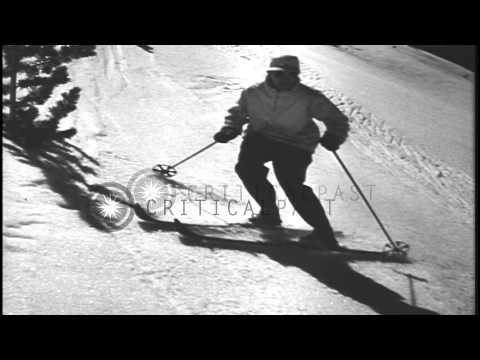 Men sliding downhill and demonstrating the traversing position in the United Stat...HD Stock Footage
