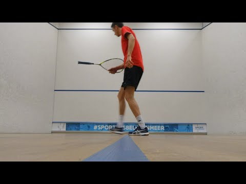 Squash trickshot with the handle of the racket