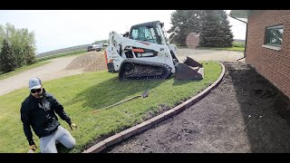 DIY Installing landscape interlock edgers , fabric and river rock around a house   Start to Finish