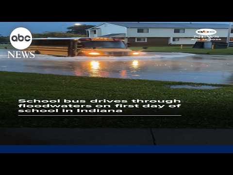 School bus drives through floodwaters on first day of school in Indiana