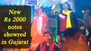 Gujarat folk singer showered with Rs 2000 notes, Watch video | Oneindia News