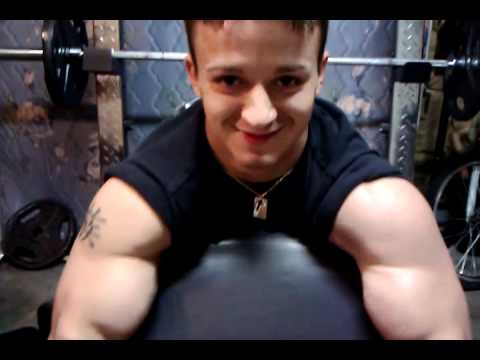 Buff guy awkwardly singing