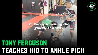 Tony Ferguson teaches kid how to ankle pick after 