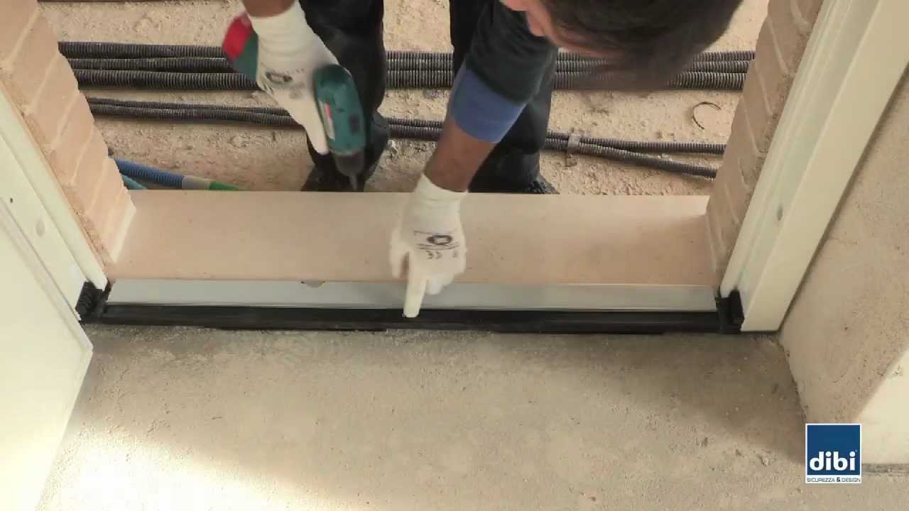 Fissaggio soglia termica/acustica DI.BI. Porte Blindate S.r.l.