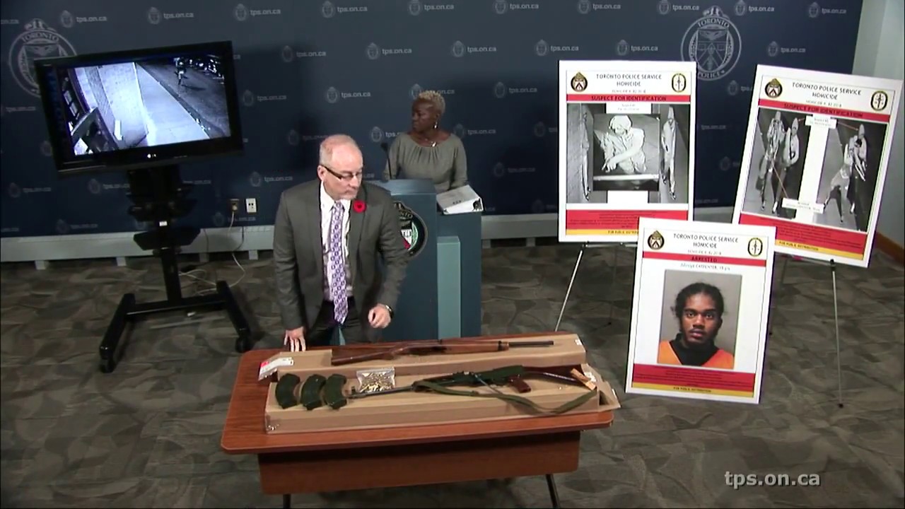 Detective Paul Worden and Sandra Cooke speak at a news conference into the murder of Dwayne McMillan