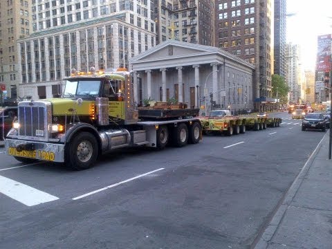 2 Peterbilt 379 's  hauling Nicholas trailers out of WTC