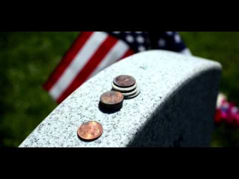 What Do The Coins Atop Veterans’ Gravestones Represent?