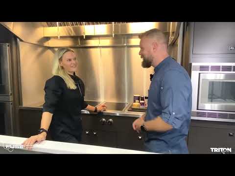 Superyacht chef Myria Tish and Danny Davies chat in the galley on board the 60m+ superyacht.