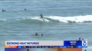 Beachgoers head to Huntington beach to beat the heat