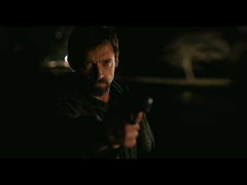 Headlights on wet asphalt; a police cruiser slices the night as strings surge