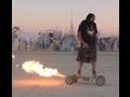 DJ Swamp riding his rocket board at Burningman