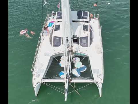 Bachelorette party swimming off catamaran yacht in Greenport, North Fork NY