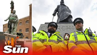 Police shield Churchill monument at BLM protest as