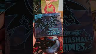 Should I open the Phantasmal Flames ETB?! Is there a cheeky charizard in there?