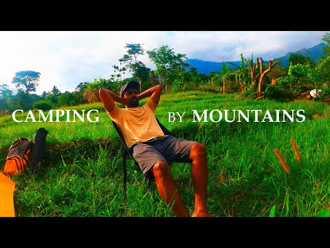 Camping In a Tent by Mountains