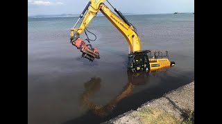 Recovery of 40 ton JCB digger stuck in the sea at Mumbles beach Swansea. J & R Millington ltd