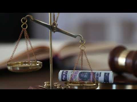 Money on scales of justice