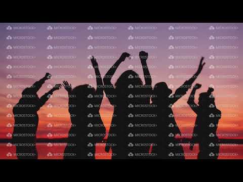 Cheerful students dancing on beach at sunset relaxing at outdoor party together