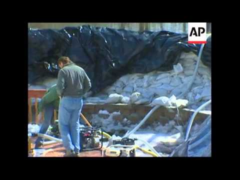 As the Red River slowly receded Sunday, Fargo was keeping a close eye on the many miles of sandbag l